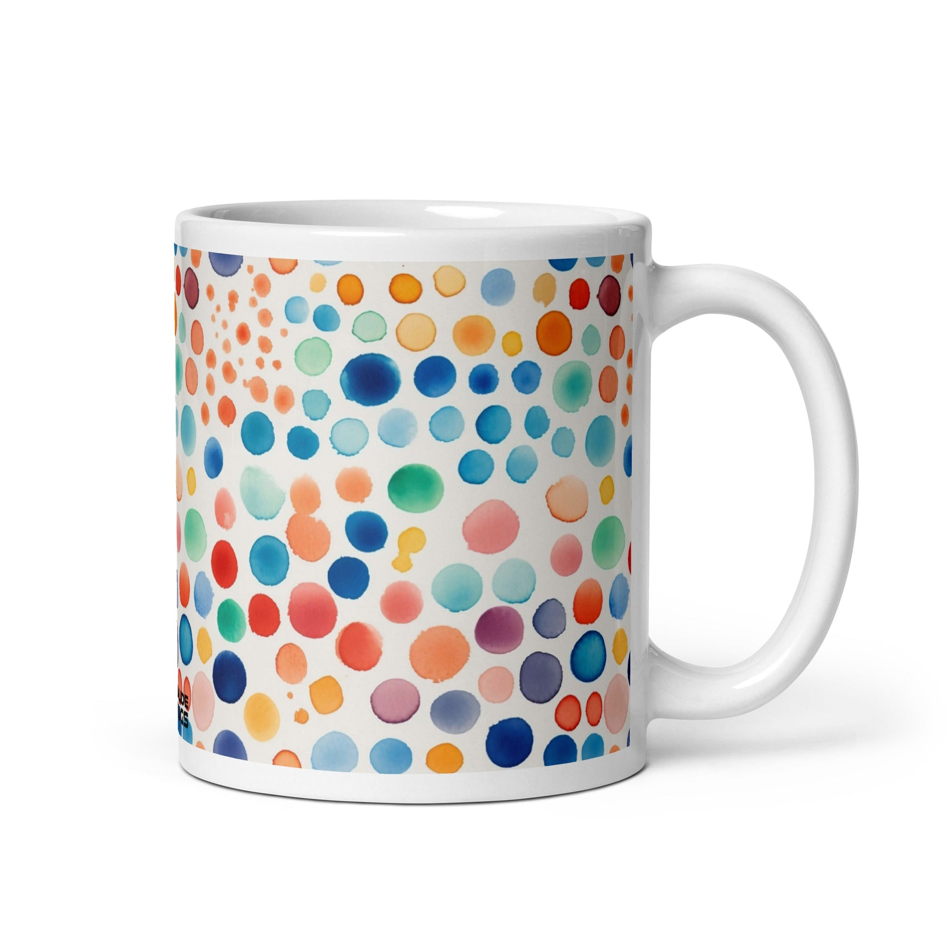 Dottie — Carnival ceramic mug by Maude Mugs — bold festive dot pattern in vibrant mixed tones, 11oz, handle on right